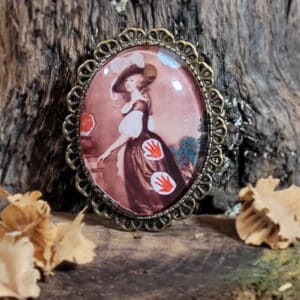 broche collage les mains rouges